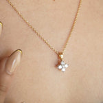 Load image into Gallery viewer, Gold necklace with a diamond pendant on a person's neck