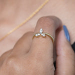Load image into Gallery viewer, Gold ring with three diamonds on a finger