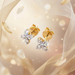 Load image into Gallery viewer, Gold earrings with diamond accents on a soft, blurred background