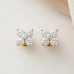 Load image into Gallery viewer, Pair of diamond stud earrings on a light fabric background